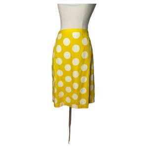 Boden yellow and white polka dot knee length skirt.